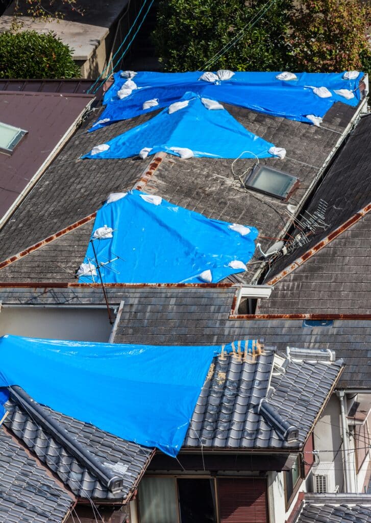 Tarps over roof leaks - Emergency Leak Guide for Flat Roofs - Select FRR